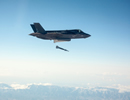 An F-35B short take-off and vertical landing (STOVL) fighter aircraft piloted by Marine Corps Maj. Richard Rusnok, successfully employed a Guided Bomb Unit-12 (GBU-12) Paveway II laser-guided weapon from the F-35's internal weapons bay against a fixed ground tank test target yesterday. 